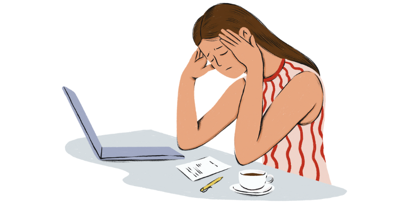 A woman in a striped singlet has her hands to her temples, frustrated, as she sits infront of a laptop.